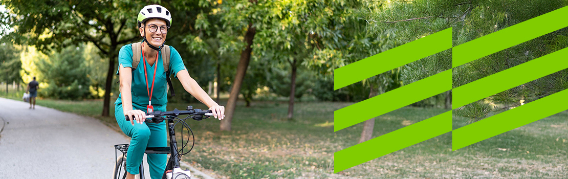 Cyclist commuting on a green route as part of a cycling to work scheme