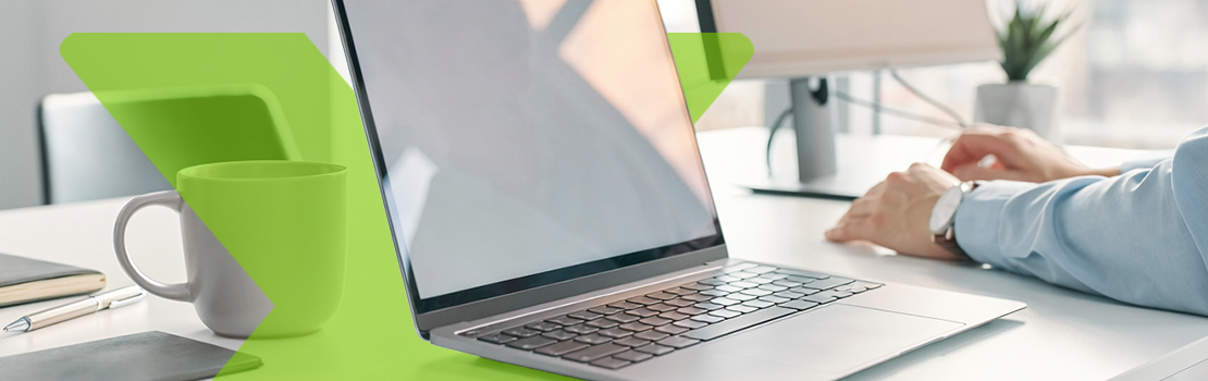 A close-up of a brand new laptop on an employee's desk, which they bought through a home and tech salary sacrifice scheme