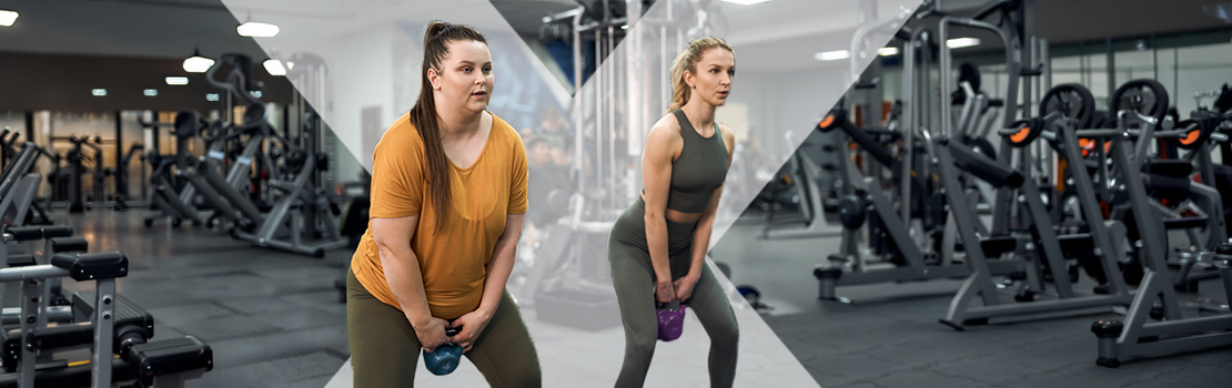 Two employees working out with kettle bells in a gym together, taking advantage of gym savings with BHN Extras health and wellbeing fringe benefits